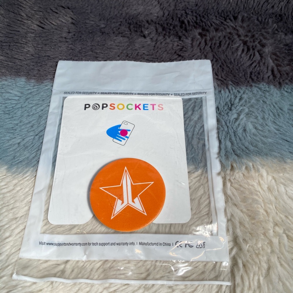 Orange Jeffree Star Pop Socket